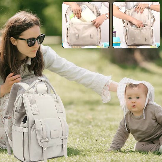 Sac à langer kaki porté en dos par une maman avec bébé-sphere de maman-nourrison

