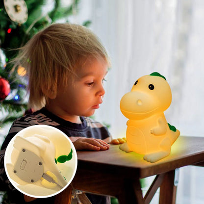 Vue de face de la lampe dinosaure allumée avec lumière verte-sphere de maman-nourrison