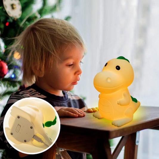 Vue de face de la lampe dinosaure allumée avec lumière verte-sphere de maman-nourrison